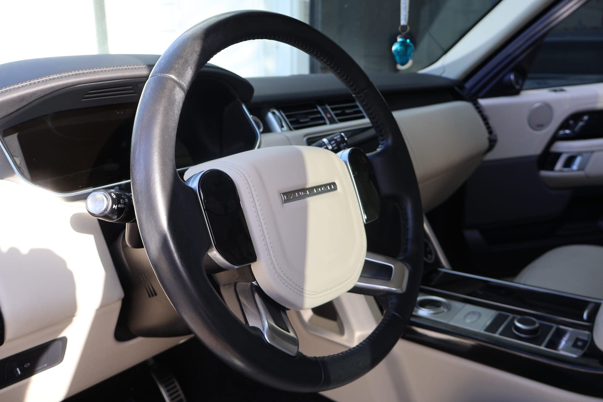 Detailed Range Rover steering wheel and dash